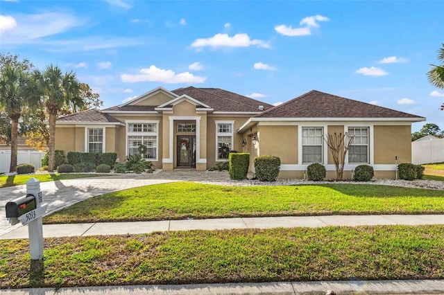 view of front of home with a front lawn