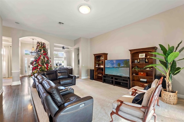 living room with hardwood / wood-style flooring and ceiling fan