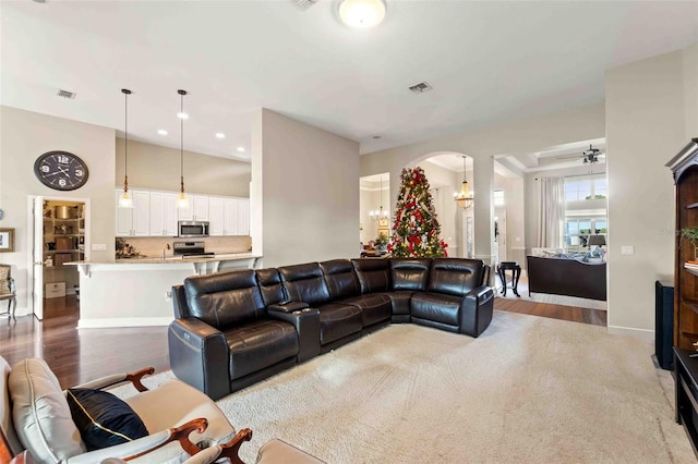 living room with light wood-type flooring and ceiling fan