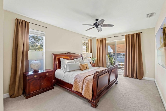 carpeted bedroom featuring access to outside and ceiling fan