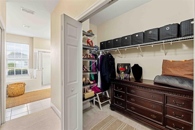 walk in closet featuring light tile patterned floors