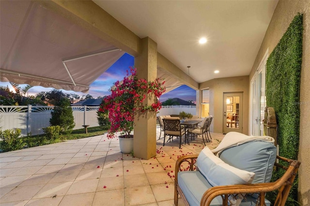 view of patio terrace at dusk