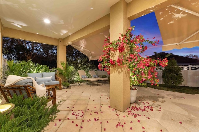 view of patio terrace at dusk