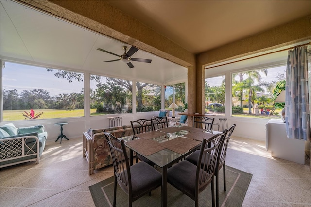 sunroom / solarium featuring ceiling fan