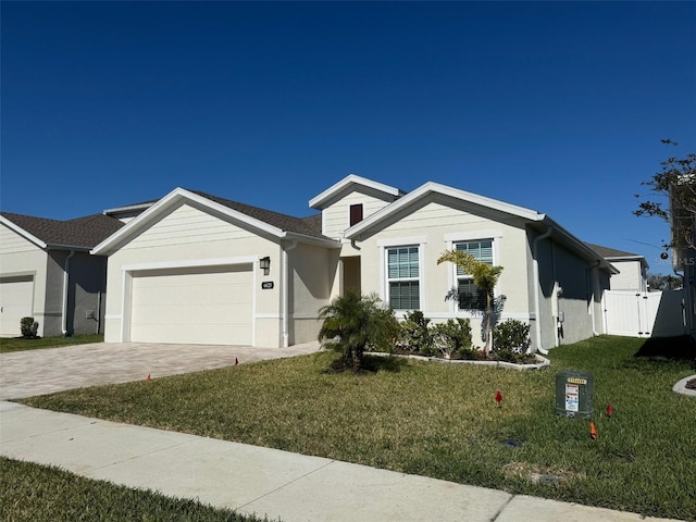 ranch-style house with a front lawn and a garage