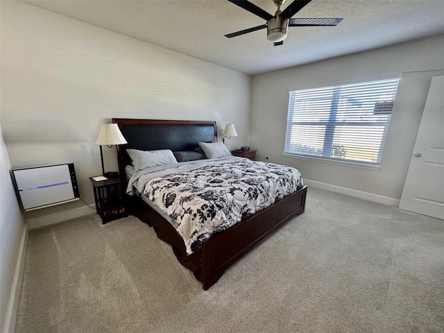 bedroom featuring ceiling fan and light colored carpet