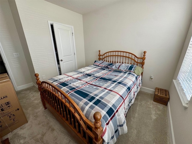 bedroom with light colored carpet