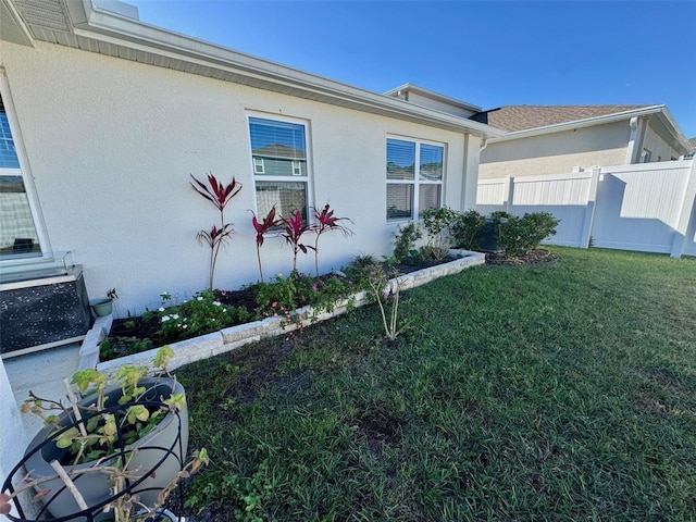 view of side of property featuring a yard