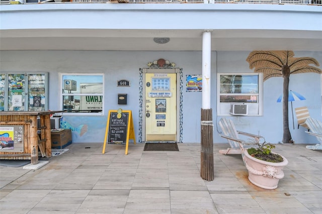 doorway to property with cooling unit