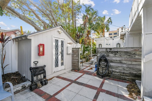 view of patio / terrace featuring a storage shed