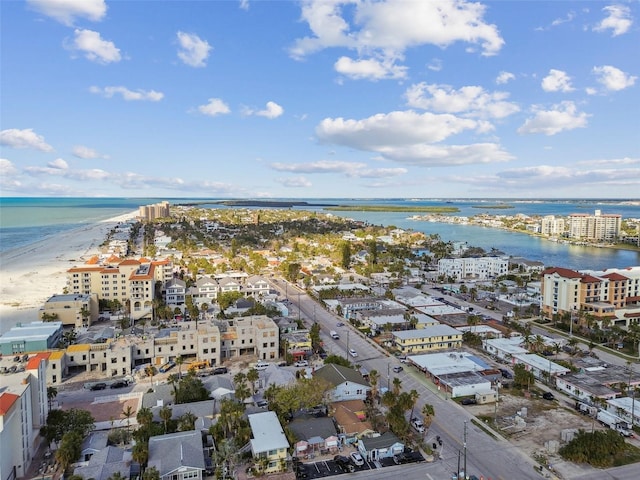 birds eye view of property with a view of the beach and a water view