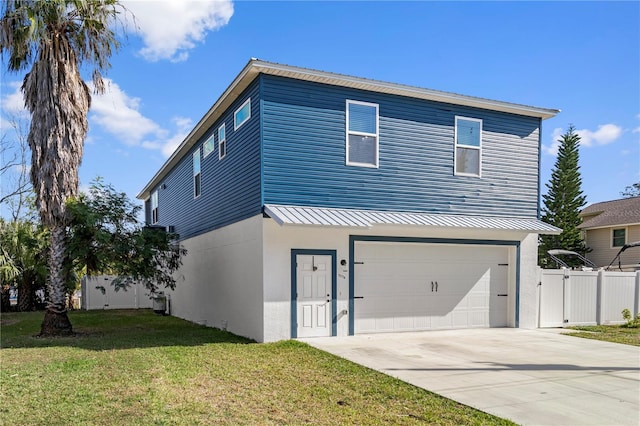 view of front facade with a garage and a front yard