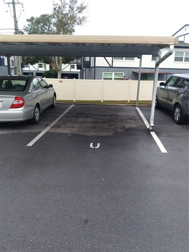 view of vehicle parking featuring a carport