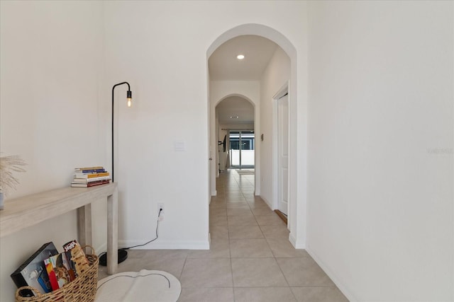 hallway with light tile patterned floors