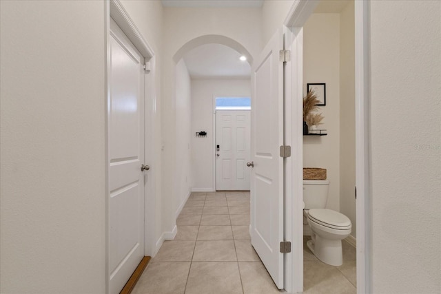 hallway with light tile patterned floors