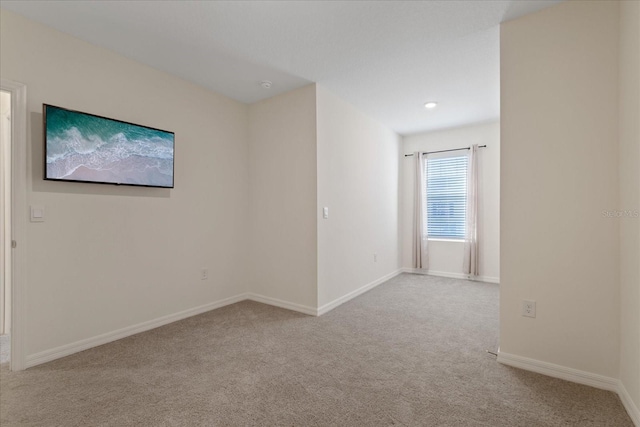 empty room with light colored carpet