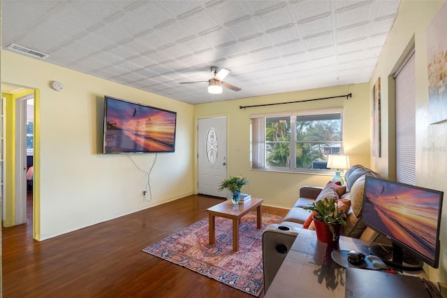 living room featuring dark hardwood / wood-style floors and ceiling fan