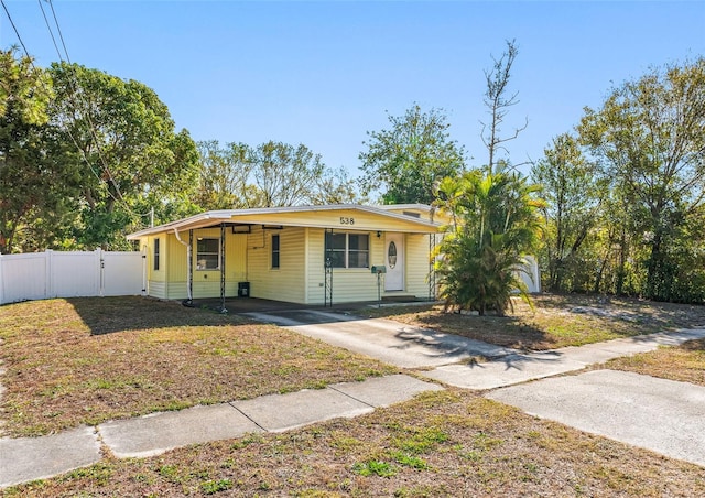 view of front of home featuring a carport