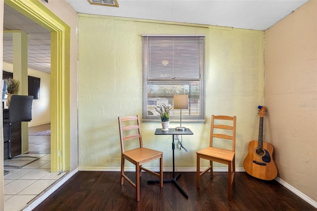 sitting room with hardwood / wood-style flooring