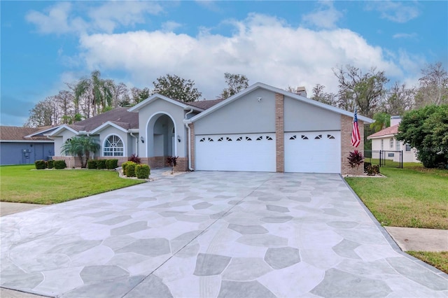 single story home with a garage and a front yard