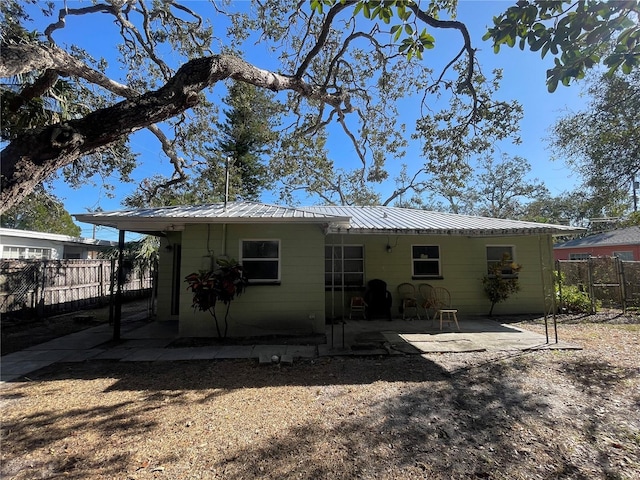 rear view of property featuring a patio