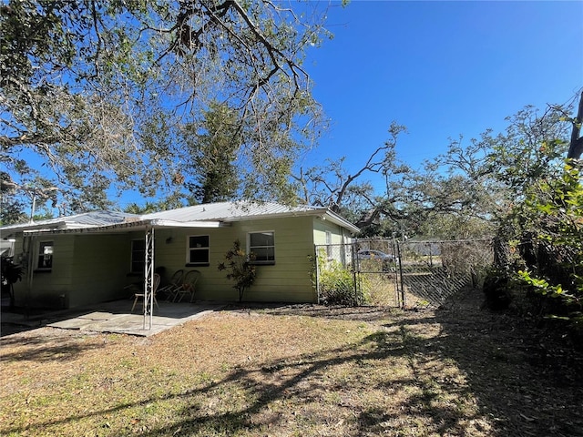 rear view of house featuring a patio area