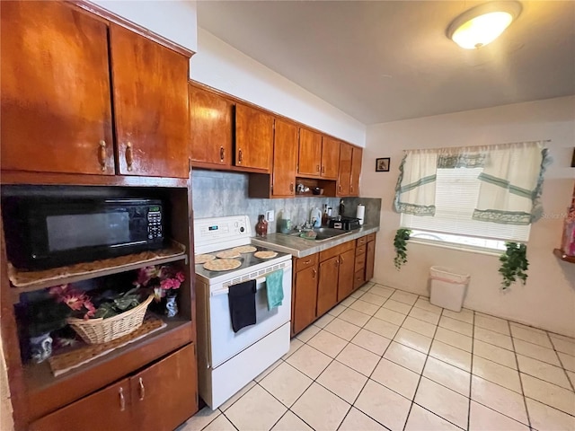 kitchen with electric stove, decorative backsplash, sink, and light tile patterned flooring