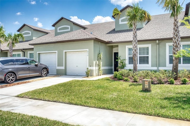 view of front of property featuring a garage and a front yard