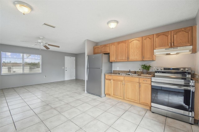 kitchen featuring light stone countertops, appliances with stainless steel finishes, ceiling fan, sink, and light tile patterned flooring