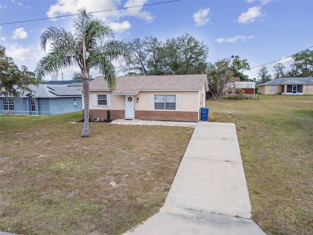 ranch-style home with a front yard