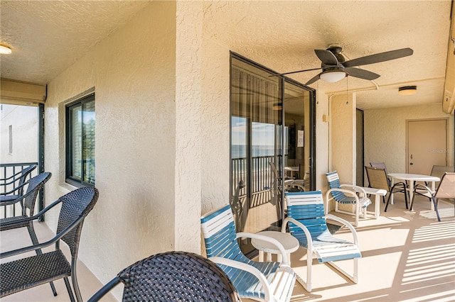 balcony featuring ceiling fan