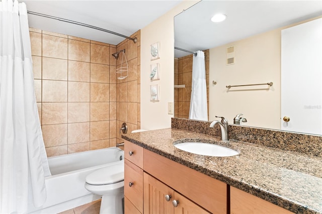 full bathroom featuring tile patterned flooring, vanity, toilet, and shower / tub combo with curtain