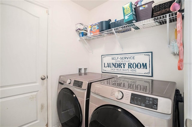 laundry room with washer and dryer