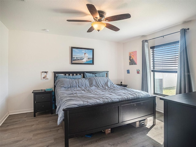 bedroom featuring hardwood / wood-style floors and ceiling fan