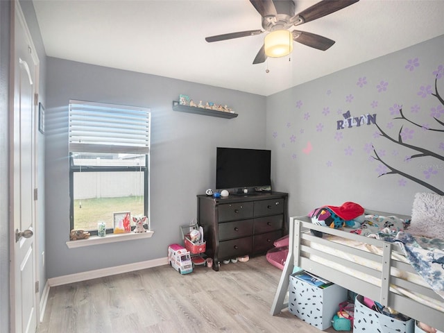 bedroom featuring ceiling fan and light hardwood / wood-style floors