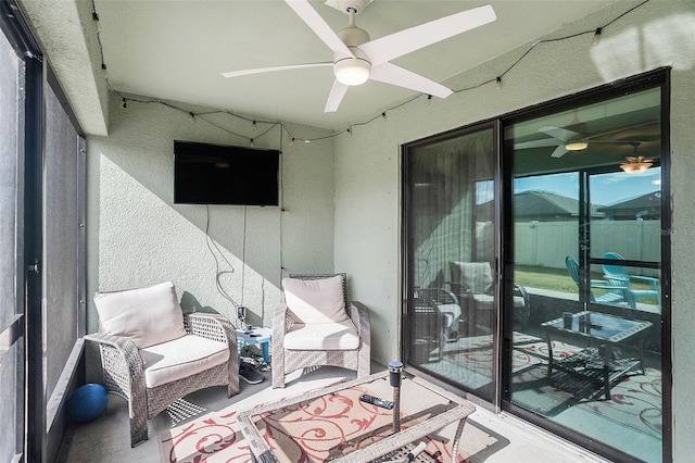 balcony featuring ceiling fan