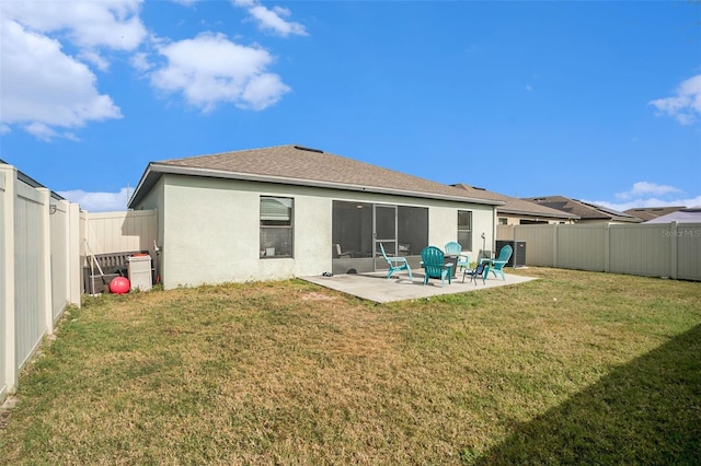 back of property featuring a yard, a patio, and central AC unit