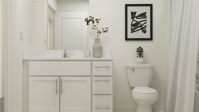 bathroom featuring vanity and toilet