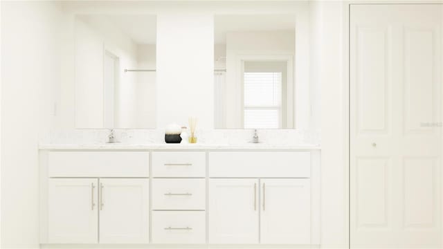 bathroom featuring vanity and a shower