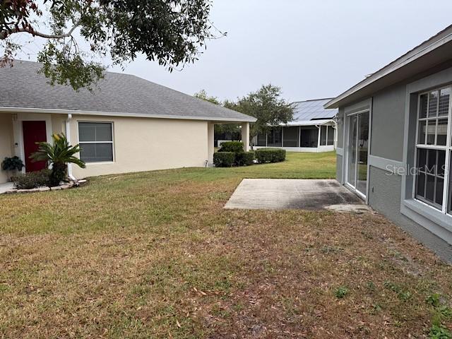 view of yard with a patio and a sunroom