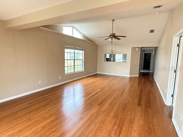 unfurnished room with ceiling fan, lofted ceiling, and hardwood / wood-style flooring