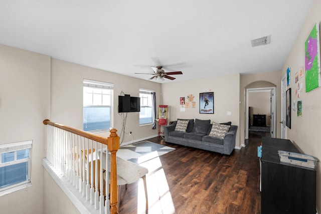 living room with ceiling fan and dark hardwood / wood-style floors