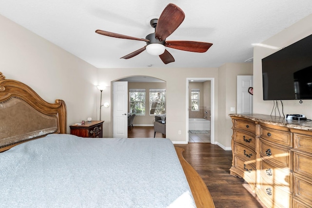 bedroom featuring ensuite bathroom, ceiling fan, and dark hardwood / wood-style floors