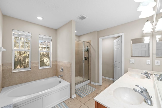 bathroom featuring tile patterned flooring, vanity, and independent shower and bath