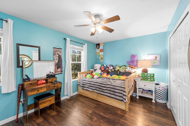 bedroom with ceiling fan, dark hardwood / wood-style floors, and a closet