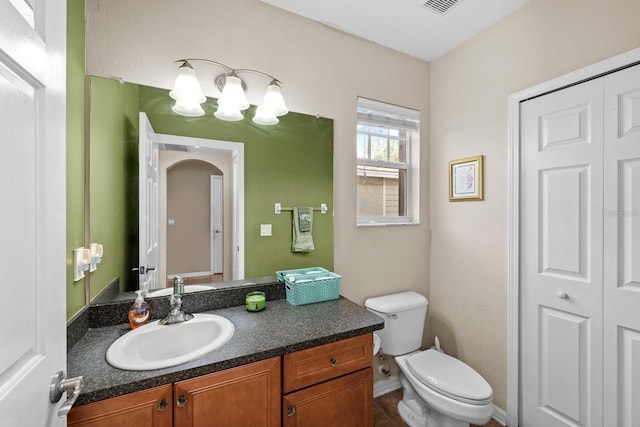 bathroom with vanity and toilet