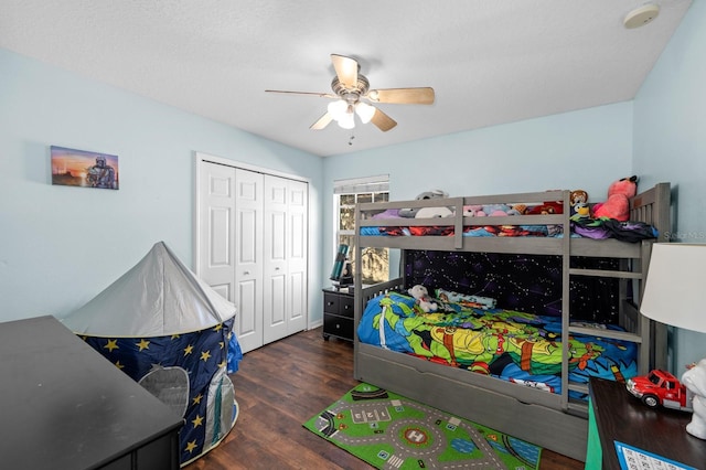 bedroom with ceiling fan, a closet, and dark hardwood / wood-style floors