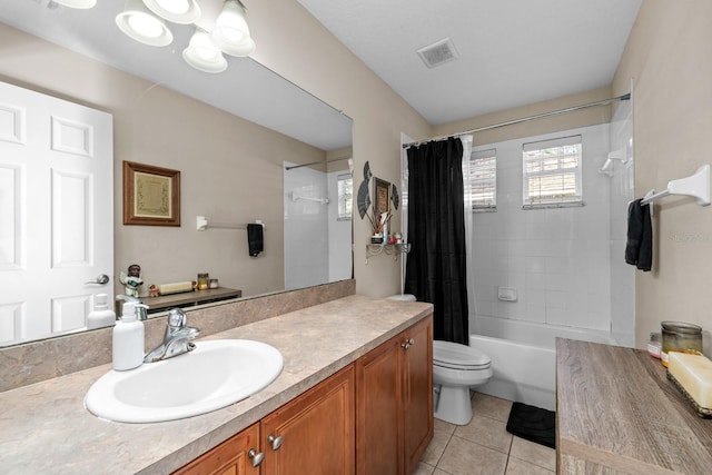 full bathroom featuring tile patterned flooring, shower / bath combination with curtain, vanity, and toilet