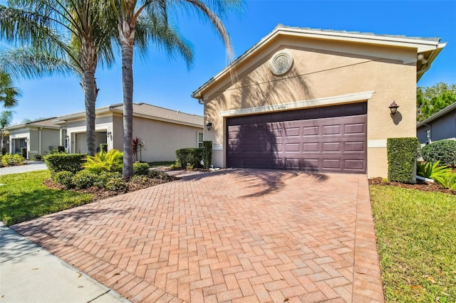 single story home featuring a garage