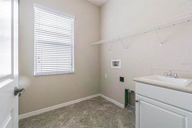 laundry room featuring hookup for a washing machine, a wealth of natural light, and sink